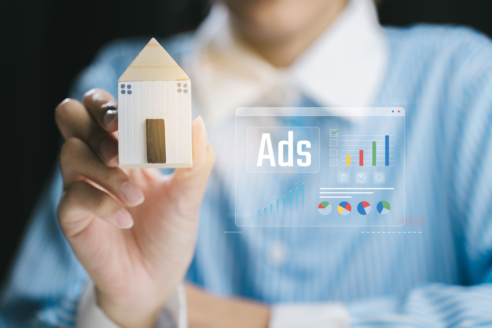 Digital Marketing Concept with Miniature House and Ad Insights